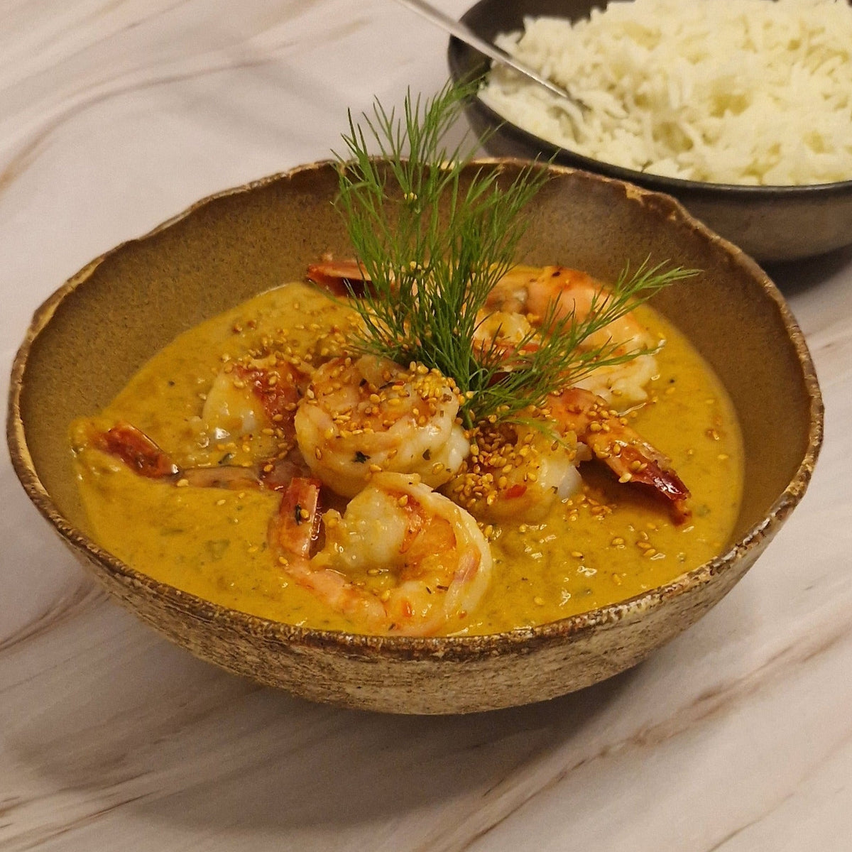 Arno’s scampi diabolique met pittige tomatenroom en basmatirijst van Arno’s to go in Beveren